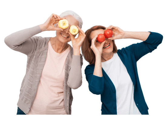 Dos mujeres saludables con frutas